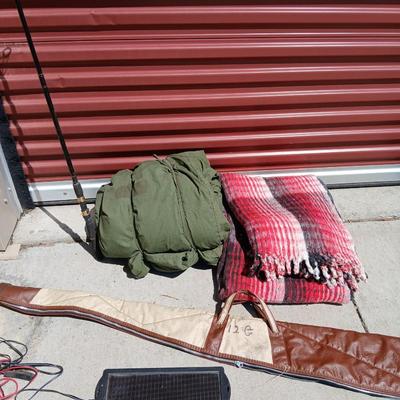 Outdoor Gear Lot – Sleeping Bag, Wool Blanket, fishing Rod, Solar Panel & Gun Case