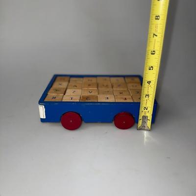 Vintage Children's ABC's Blocks in a blue car with red wheels