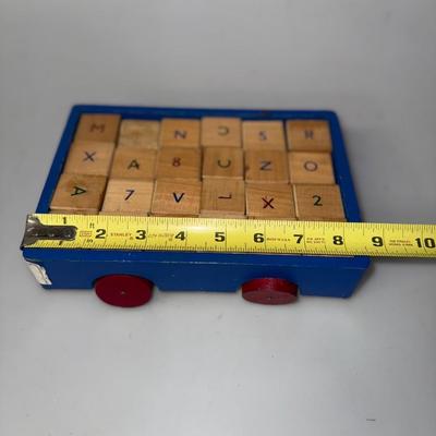Vintage Children's ABC's Blocks in a blue car with red wheels