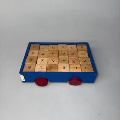 Vintage Children's ABC's Blocks in a blue car with red wheels
