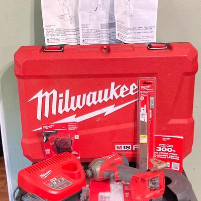 LOT 58: Milwaukee Tools and Accessories - Fuel Hex Hydraulic Driver, Charger with Storage Case and More