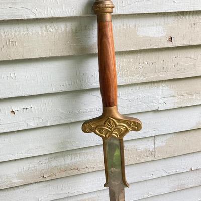 LOT 75: Large Barbarian Wood / Brass Handle Sword with Black Sheath