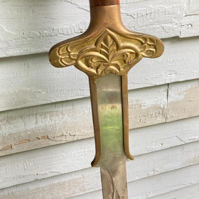 LOT 75: Large Barbarian Wood / Brass Handle Sword with Black Sheath