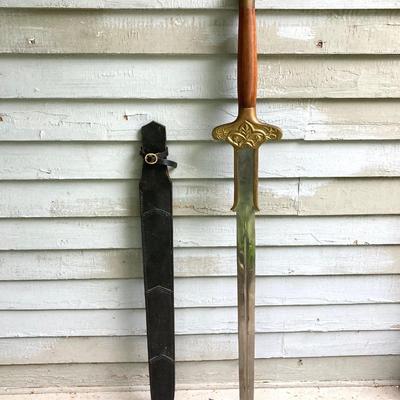 LOT 75: Large Barbarian Wood / Brass Handle Sword with Black Sheath