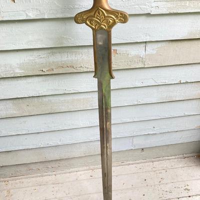LOT 75: Large Barbarian Wood / Brass Handle Sword with Black Sheath