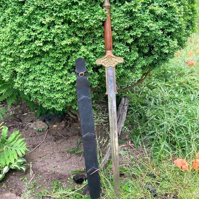 LOT 75: Large Barbarian Wood / Brass Handle Sword with Black Sheath