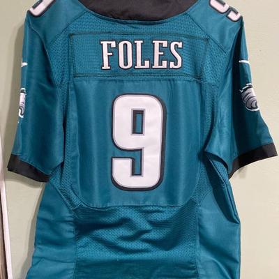 LOT 77: Nick Foles Eagles NFL Super Bowl Jersey Size 44, Football Cards, The Great Book of Philadelphia Sports Lists, Donovan McNabb...