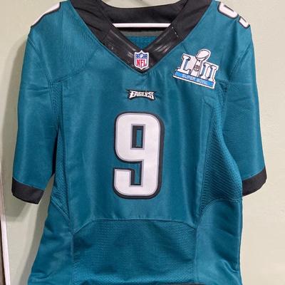 LOT 77: Nick Foles Eagles NFL Super Bowl Jersey Size 44, Football Cards, The Great Book of Philadelphia Sports Lists, Donovan McNabb...