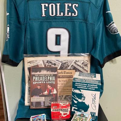 LOT 77: Nick Foles Eagles NFL Super Bowl Jersey Size 44, Football Cards, The Great Book of Philadelphia Sports Lists, Donovan McNabb...