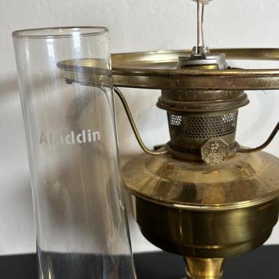 LOT 84: Porcelain Art Nouveau Style Figural Vase, Brass Candle Sticks & Aladdin Oil Brass Oil Lamp (missing shade)