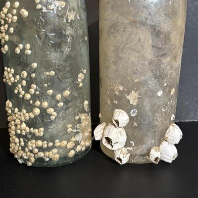LOT 85: Seaside Collection: Ceramic Lighthouse Lamp, Wooden Carved Pelican, Sea Glass Bottles w/Barnacles, Lighthouse Painting on Slate,...