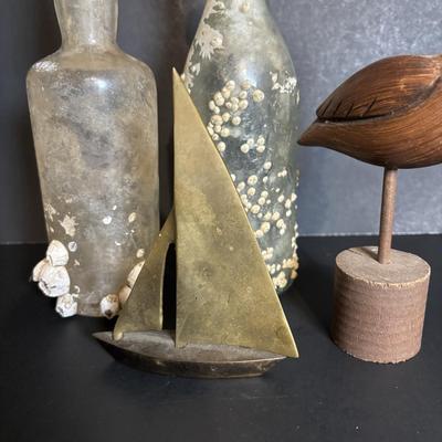 LOT 85: Seaside Collection: Ceramic Lighthouse Lamp, Wooden Carved Pelican, Sea Glass Bottles w/Barnacles, Lighthouse Painting on Slate,...
