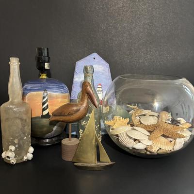 LOT 85: Seaside Collection: Ceramic Lighthouse Lamp, Wooden Carved Pelican, Sea Glass Bottles w/Barnacles, Lighthouse Painting on Slate,...