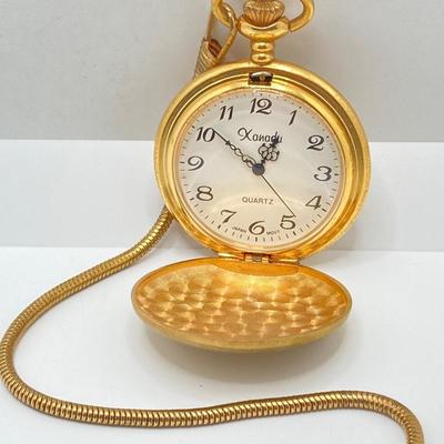 LOT 123: Pair of Gold Tone Pocket Watches with Chains (Unitron and Xanadu)
