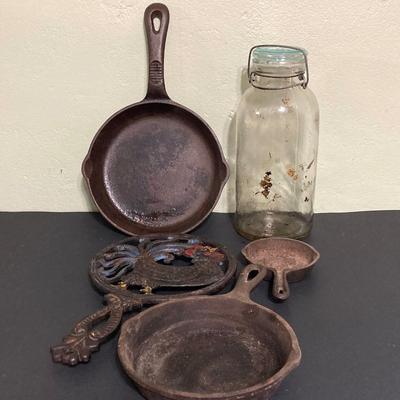 LOT 130: Vintage Cast Iron Cookware (Lodge, Benjamin Medwin and More) / Trivet and Tall Glass Mason Jar