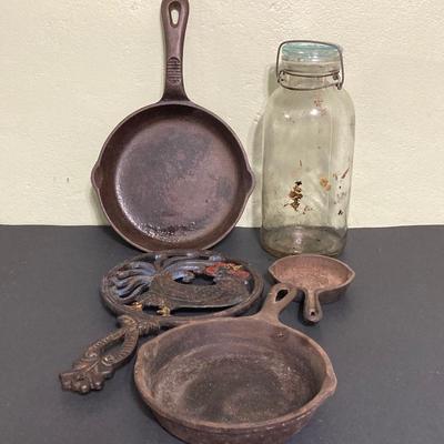 LOT 130: Vintage Cast Iron Cookware (Lodge, Benjamin Medwin and More) / Trivet and Tall Glass Mason Jar