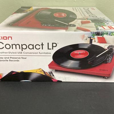 LOT 134: Ion Compact LP Turntable / Player in Original Box with Collection of 45 Records
