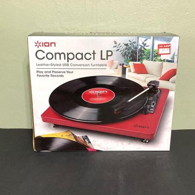 LOT 134: Ion Compact LP Turntable / Player in Original Box with Collection of 45 Records