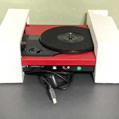 LOT 134: Ion Compact LP Turntable / Player in Original Box with Collection of 45 Records