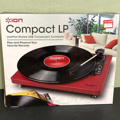 LOT 134: Ion Compact LP Turntable / Player in Original Box with Collection of 45 Records