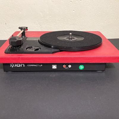LOT 134: Ion Compact LP Turntable / Player in Original Box with Collection of 45 Records