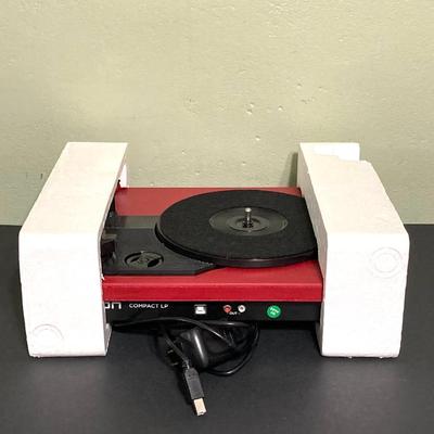 LOT 134: Ion Compact LP Turntable / Player in Original Box with Collection of 45 Records