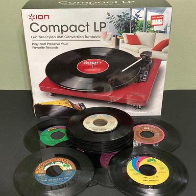 LOT 134: Ion Compact LP Turntable / Player in Original Box with Collection of 45 Records