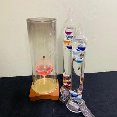 LOT 190: Wilford Blown Glass Oil Lamp and a Set of Two (2) Galileo Thermometers