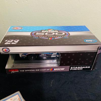 LOT 191: NASCAR Collection Including Lionel Racing Die Cast Car, Racing Champions Truck, NASCAR 75th Anniversary Coin, Earnhardt Singed...