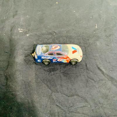 LOT 191: NASCAR Collection Including Lionel Racing Die Cast Car, Racing Champions Truck, NASCAR 75th Anniversary Coin, Earnhardt Singed...
