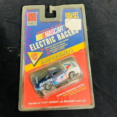 LOT 191: NASCAR Collection Including Lionel Racing Die Cast Car, Racing Champions Truck, NASCAR 75th Anniversary Coin, Earnhardt Singed...