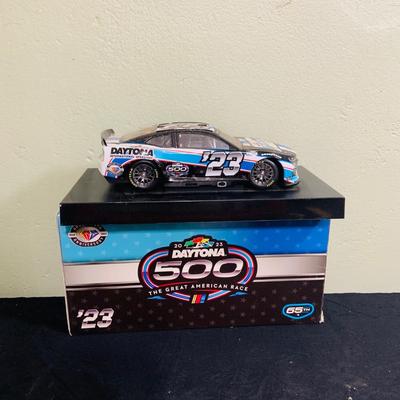 LOT 191: NASCAR Collection Including Lionel Racing Die Cast Car, Racing Champions Truck, NASCAR 75th Anniversary Coin, Earnhardt Singed...