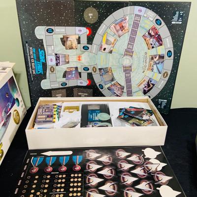 LOT 193: Star Trek Next Generation VCR Board Game with Philips VCR, D&D Figures, Never Used Mancala Game Space Book and More