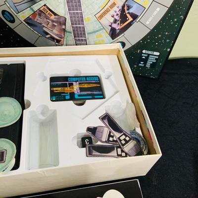 LOT 193: Star Trek Next Generation VCR Board Game with Philips VCR, D&D Figures, Never Used Mancala Game Space Book and More