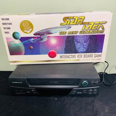LOT 193: Star Trek Next Generation VCR Board Game with Philips VCR, D&D Figures, Never Used Mancala Game Space Book and More