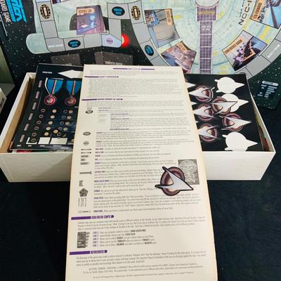 LOT 193: Star Trek Next Generation VCR Board Game with Philips VCR, D&D Figures, Never Used Mancala Game Space Book and More