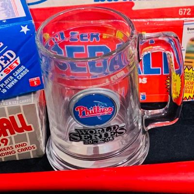 LOT 194: Baseball Collection - Opened and Unopened Boxes of Baseball Cards, Phillies Mini Bat and 2008 World Series Glass