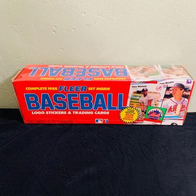 LOT 194: Baseball Collection - Opened and Unopened Boxes of Baseball Cards, Phillies Mini Bat and 2008 World Series Glass