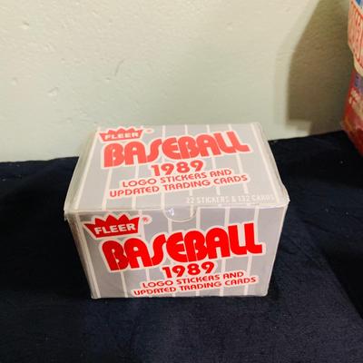 LOT 194: Baseball Collection - Opened and Unopened Boxes of Baseball Cards, Phillies Mini Bat and 2008 World Series Glass