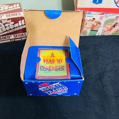 LOT 194: Baseball Collection - Opened and Unopened Boxes of Baseball Cards, Phillies Mini Bat and 2008 World Series Glass