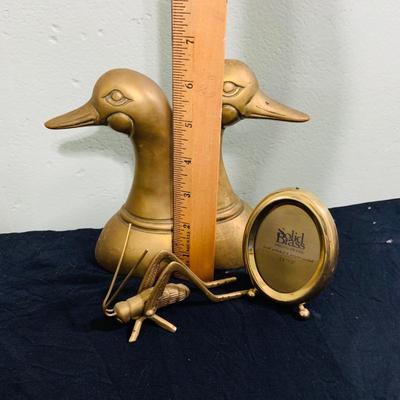 LOT 195: Brass Duck Head Book Ends, Brass Cricket and Mini Picture Frame