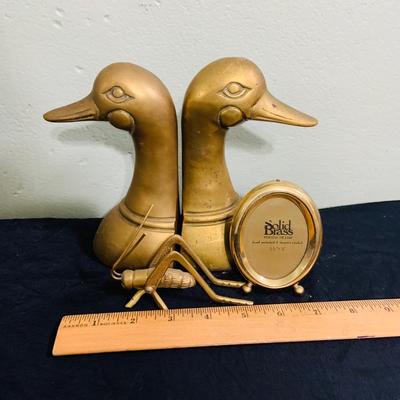 LOT 195: Brass Duck Head Book Ends, Brass Cricket and Mini Picture Frame