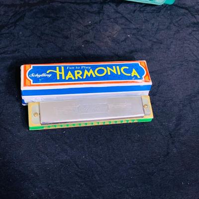LOT 197: Collection of Vintage Harmonicas by Lark, Horner, Schylling and Hero