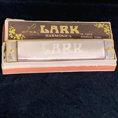 LOT 197: Collection of Vintage Harmonicas by Lark, Horner, Schylling and Hero