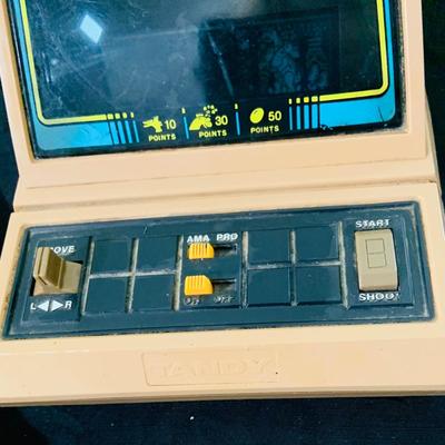 LO 207: Collection of Vintage Toys, Game and Marbles Featuring Tandy Caveman Electronic Table Top Game, Fred Flintstone Wooden Puzzle,...