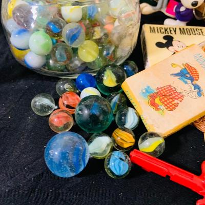 LO 207: Collection of Vintage Toys, Game and Marbles Featuring Tandy Caveman Electronic Table Top Game, Fred Flintstone Wooden Puzzle,...