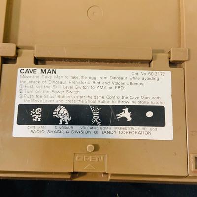 LO 207: Collection of Vintage Toys, Game and Marbles Featuring Tandy Caveman Electronic Table Top Game, Fred Flintstone Wooden Puzzle,...