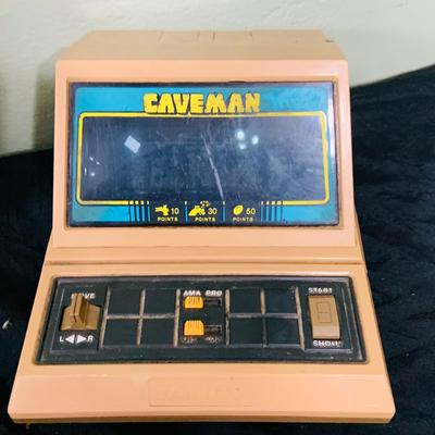 LO 207: Collection of Vintage Toys, Game and Marbles Featuring Tandy Caveman Electronic Table Top Game, Fred Flintstone Wooden Puzzle,...