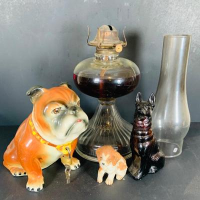 LOT 213: Vintage Bull Dog 2 Piece Porcelain Bank with Lock and Key Made in Japan, Homco and Avon Dogs and a Oil Lamp