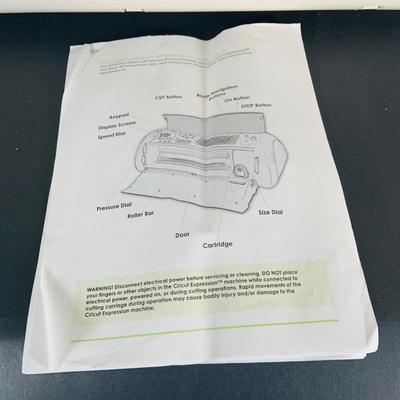 LOT 215: Cricut Expression Machine for Cutting Vinyl Includes Rolls of Vinyl and Expansion Package and More. Cord is Missing
